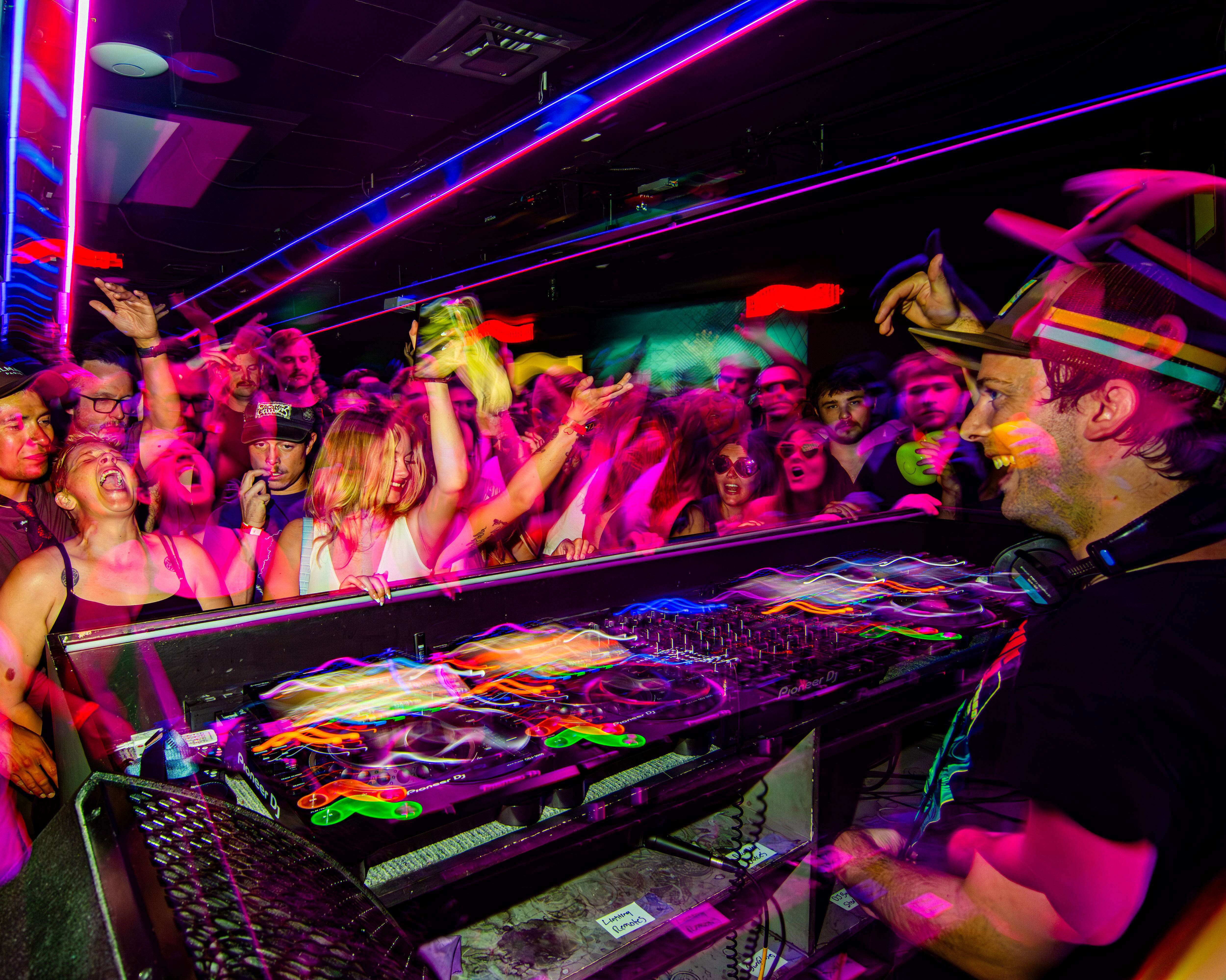 John DJing at a packed club